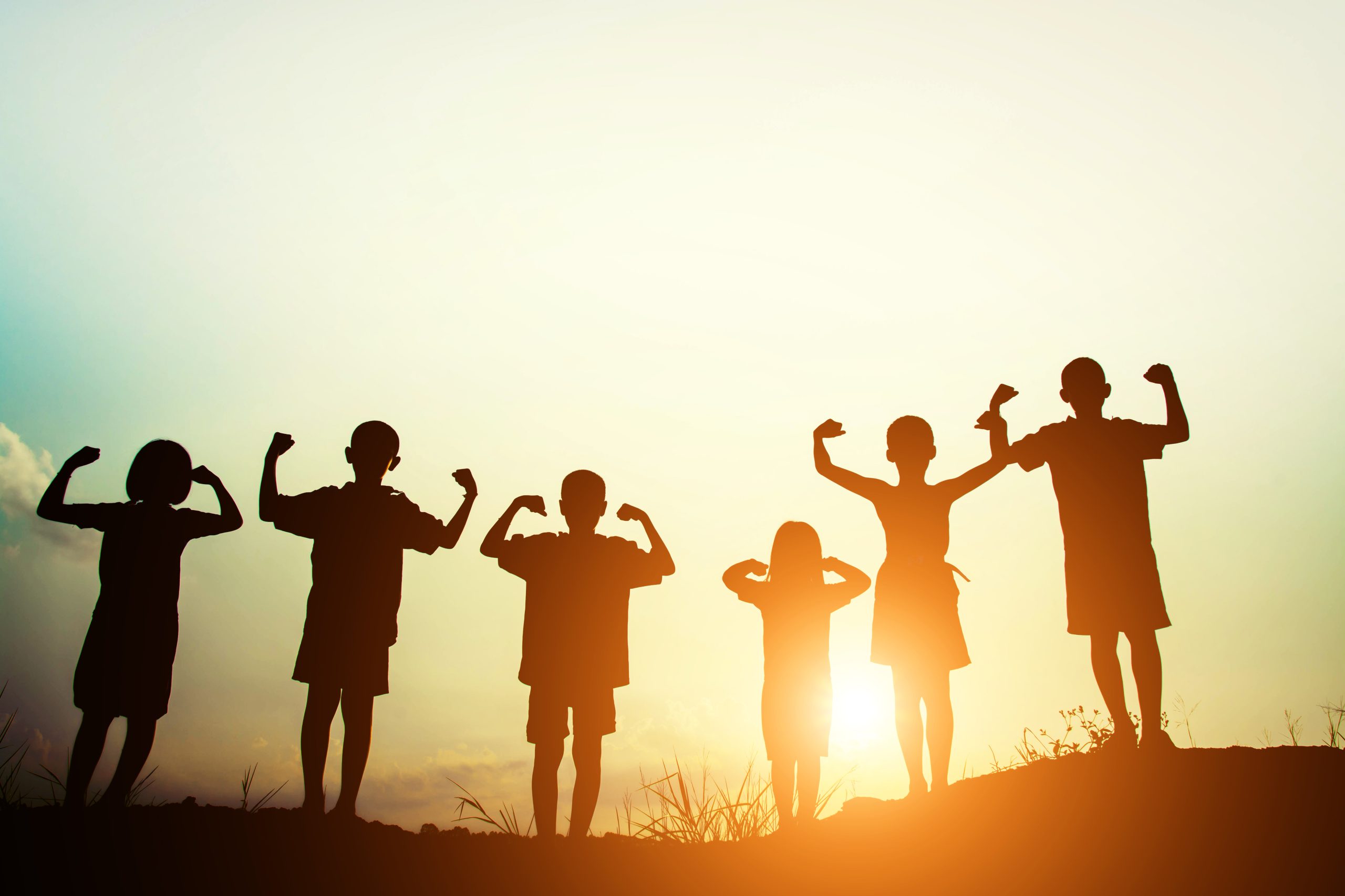 silhouette of a happy children and happy time with sunset.